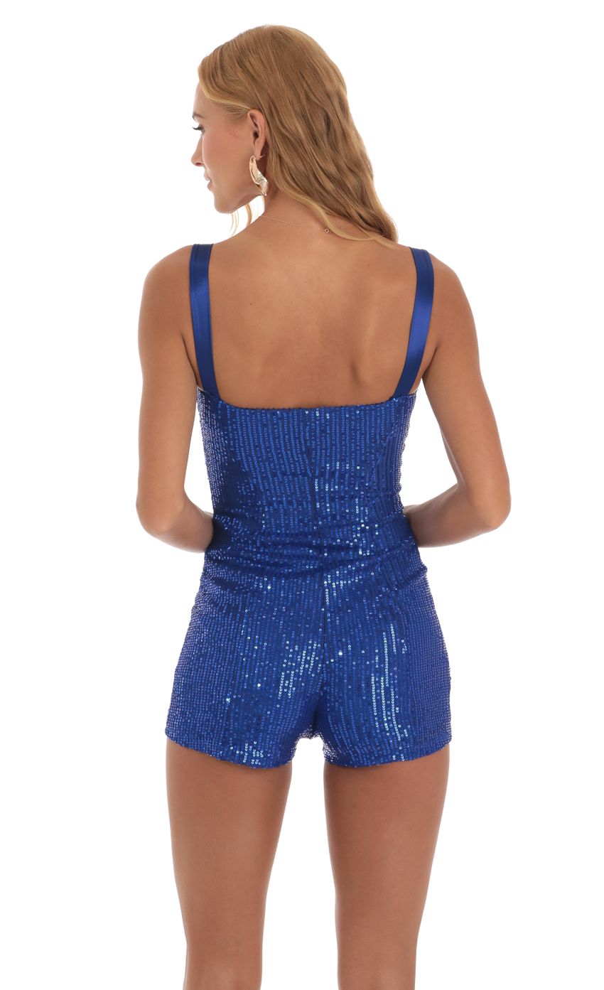 Picture Rada Sequin Hook and Eye Romper in Blue. Source: https://media.lucyinthesky.com/data/Jun23/850xAUTO/7013db74-5f33-4a0b-b244-0a55bd53a115.jpg
