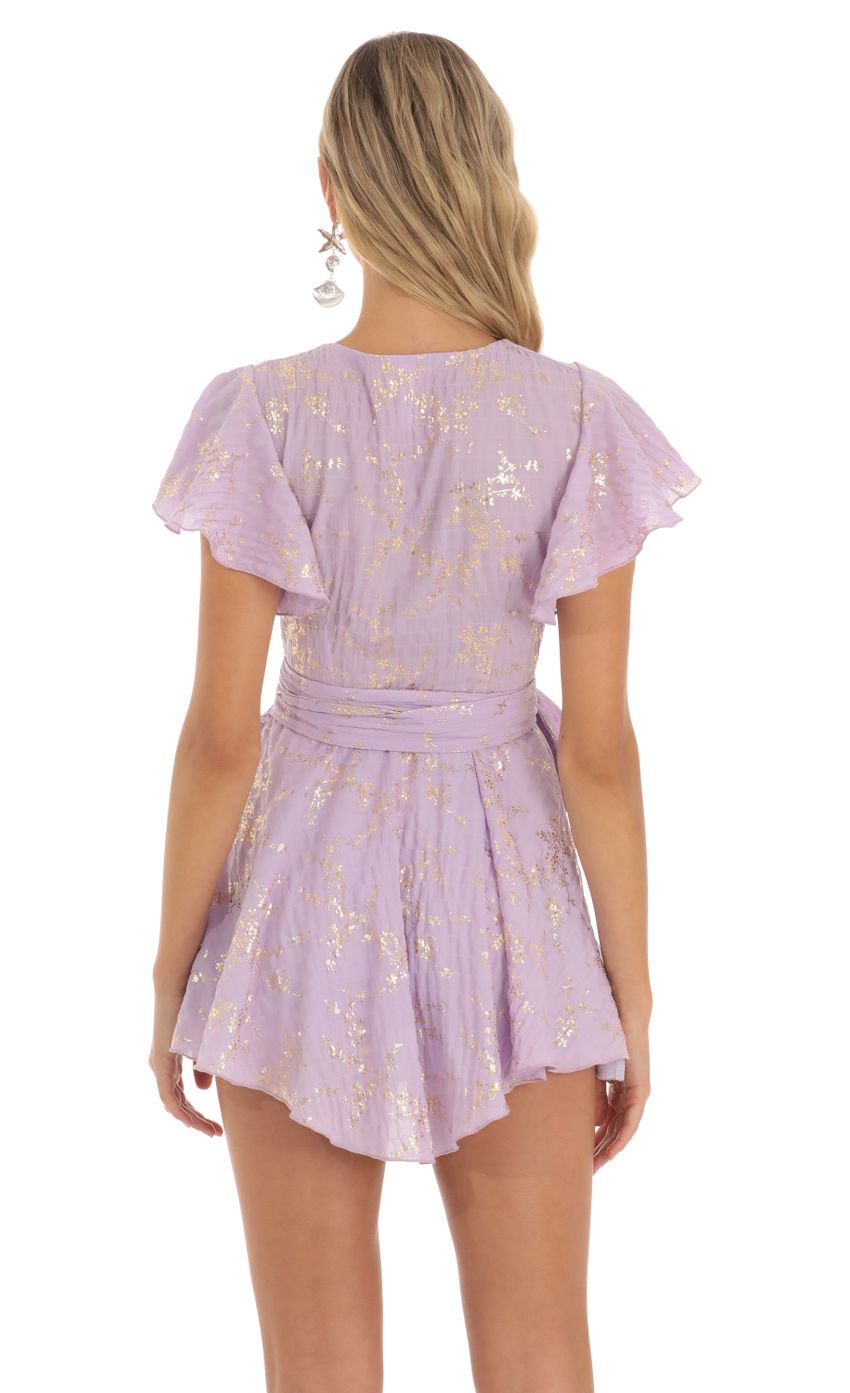 Picture Eliza Shimmer Floral Wrap Dress in Purple. Source: https://media.lucyinthesky.com/data/Jun23/850xAUTO/bfff7b0b-a4d6-468e-9b4d-7515050d4d3c.jpg