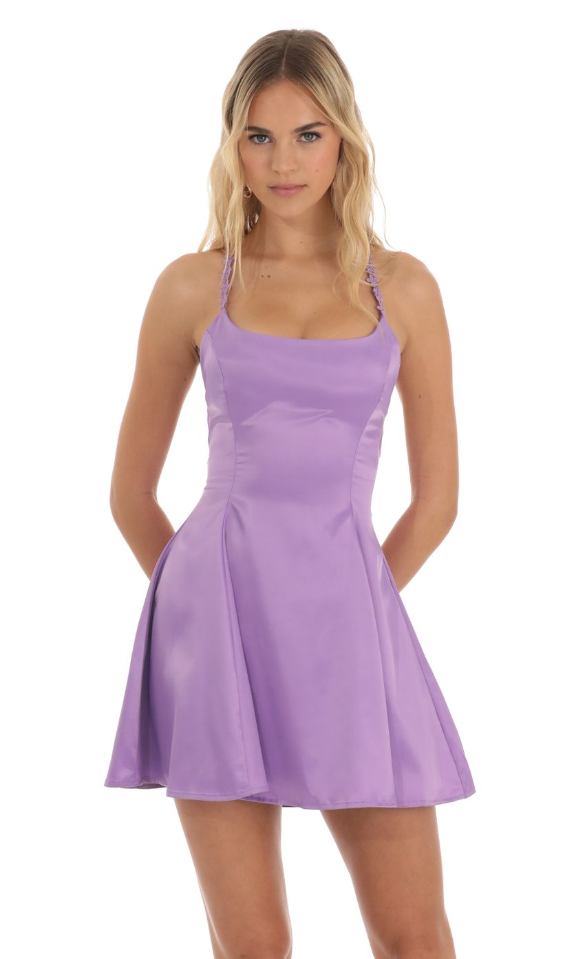 Picture Linnea Satin Floral Flare Dress in Purple. Source: https://media.lucyinthesky.com/data/Jun23/850xAUTO/ca542883-bc4a-45c9-a892-61768349ad23.jpg