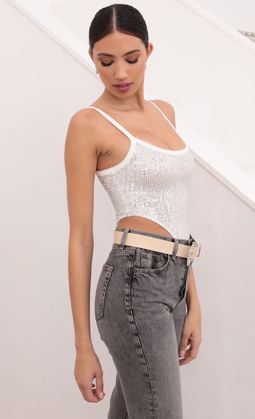 Picture Ciera High-Cut Bodysuit in Silver Sequins. Source: https://media.lucyinthesky.com/data/Mar21_1/500xAUTO/1V9A6201.JPG