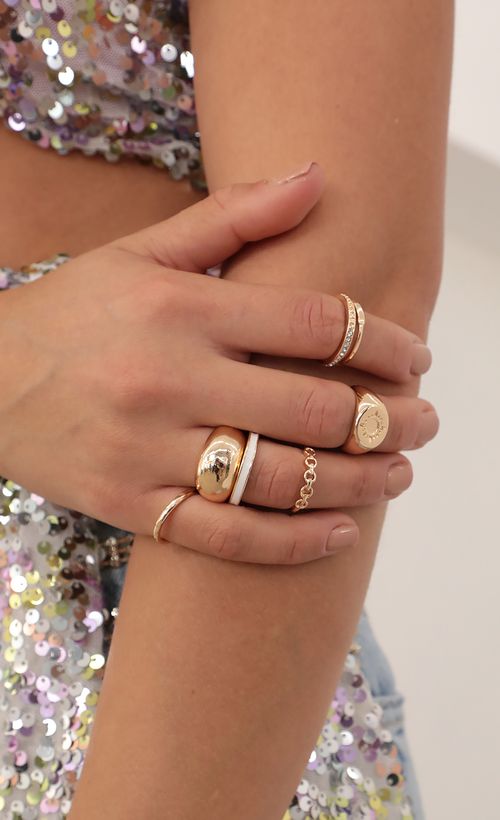 Picture 7 Piece Ring Set in Gold. Source: https://media.lucyinthesky.com/data/Mar21_1/500xAUTO/AT2A7607_COPY.JPG
