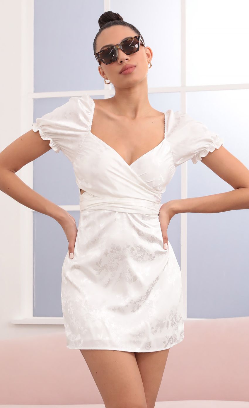 Picture Miley Puff Sleeve Wrap Dress in White Floral. Source: https://media.lucyinthesky.com/data/Mar21_1/850xAUTO/1V9A4250.JPG