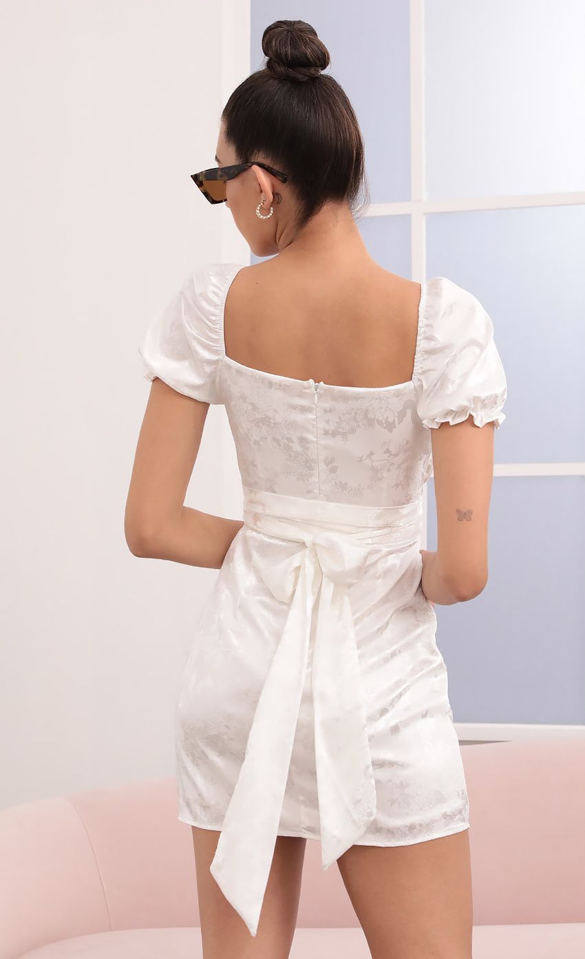 Picture Miley Puff Sleeve Wrap Dress in White Floral. Source: https://media.lucyinthesky.com/data/Mar21_1/850xAUTO/1V9A4301.JPG
