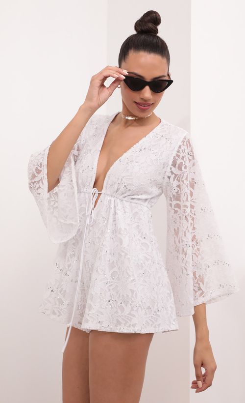 Picture Kadee Bell Sleeve Romper in White Sequined Lace. Source: https://media.lucyinthesky.com/data/Mar21_2/500xAUTO/1V9A5590.JPG