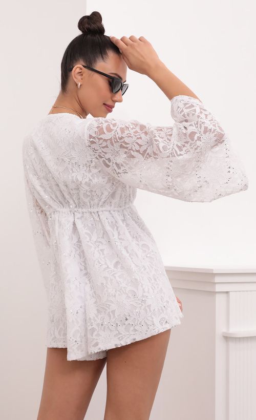 Picture Kadee Bell Sleeve Romper in White Sequined Lace. Source: https://media.lucyinthesky.com/data/Mar21_2/500xAUTO/1V9A5613.JPG
