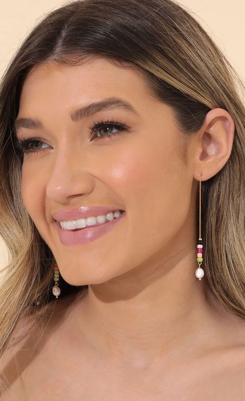 Picture Beach Please Earring in Gold. Source: https://media.lucyinthesky.com/data/Mar22_1/500xAUTO/1V9A67621.JPG