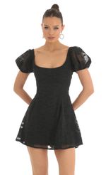 Picture Wannda Floral Puff Sleeve Dress in Black. Source: https://media.lucyinthesky.com/data/Mar23/150xAUTO/638f1627-6fd5-4fa7-9e6c-c3626fe6fde9.jpg