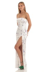 Picture thumb Nicholya Satin Floral Maxi Dress in White. Source: https://media.lucyinthesky.com/data/Mar23/170xAUTO/7d8ea4b5-5a09-485d-ba74-9852a47c44c3.jpg