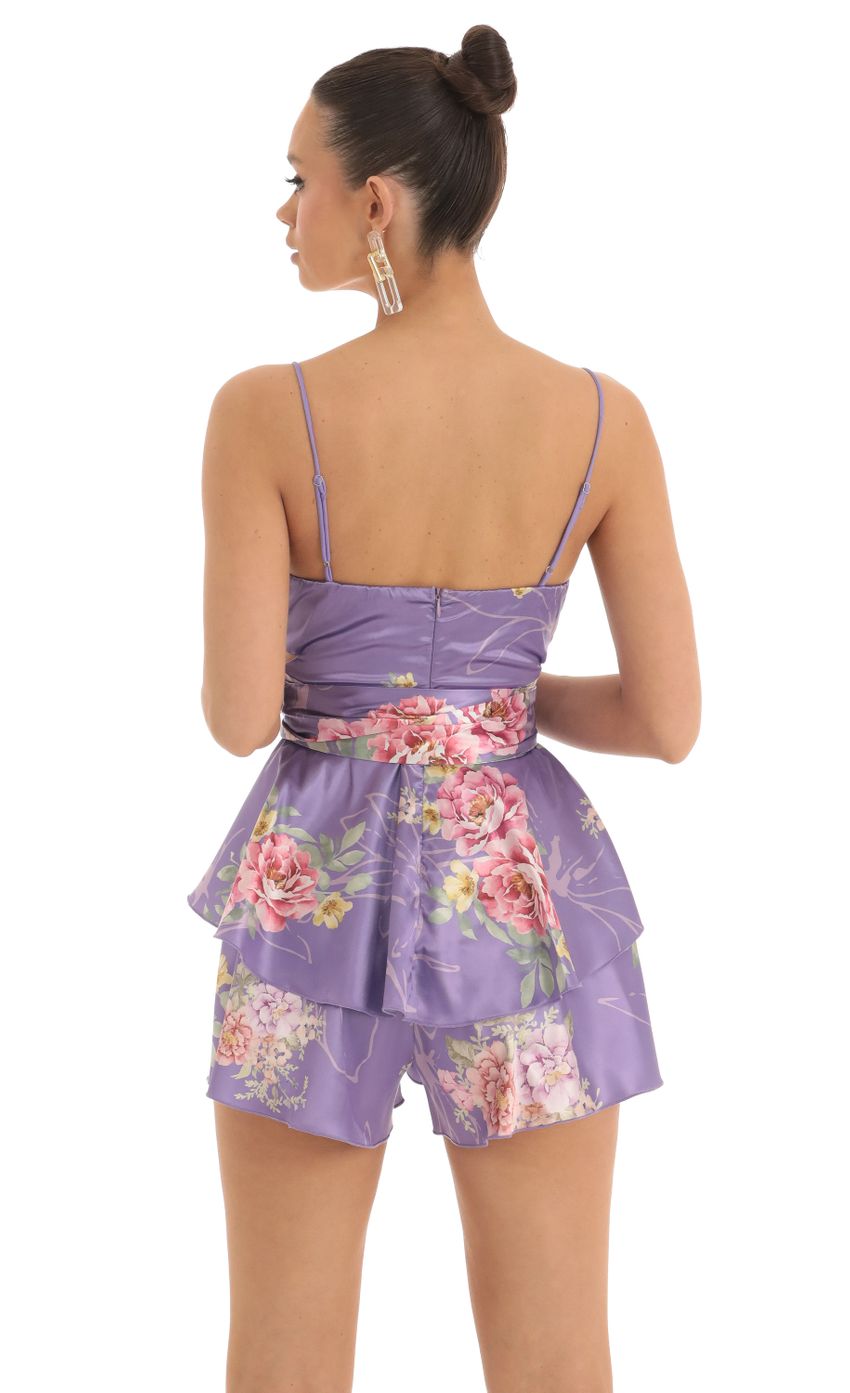Picture Shelby Ruffle Baby Doll Romper in Purple Floral. Source: https://media.lucyinthesky.com/data/Mar23/850xAUTO/59b9e182-806a-496e-a661-a4f9b52a4a20.jpg