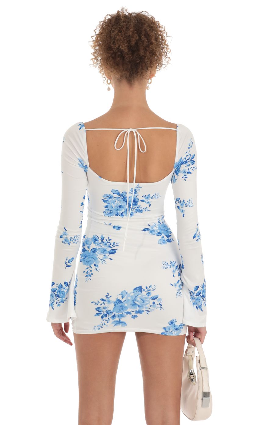 Picture Paola Floral Long Sleeve Dress in White. Source: https://media.lucyinthesky.com/data/Mar23/850xAUTO/68600d5f-34ec-451d-a7f0-f94654fbe520.jpg