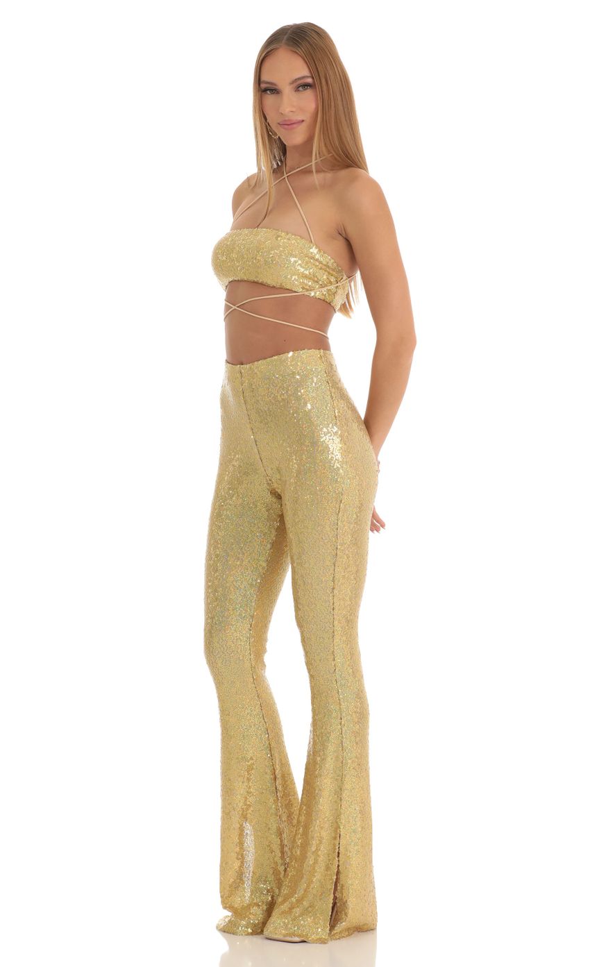 Picture Atlantis Iridescent Sequin Two Piece Pants Set in Gold. Source: https://media.lucyinthesky.com/data/Mar23/850xAUTO/85779462-af49-48d4-9a39-8198925d5d48.jpg