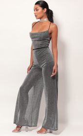 Picture thumb Eliana Cowl Neck Jumpsuit in Black Shimmer. Source: https://media.lucyinthesky.com/data/May19_2/170xAUTO/781A0739.JPG