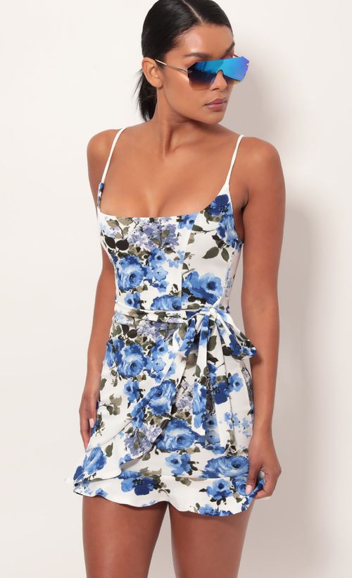 Picture Capri Ruffle Tie Dress in Blue Floral. Source: https://media.lucyinthesky.com/data/May19_2/500xAUTO/781A9212.JPG