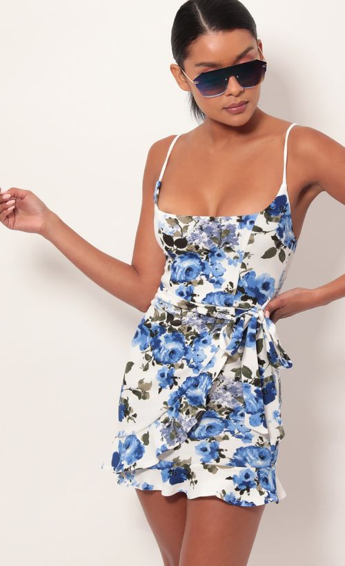Picture Capri Ruffle Tie Dress in Blue Floral. Source: https://media.lucyinthesky.com/data/May19_2/500xAUTO/781A9215.JPG