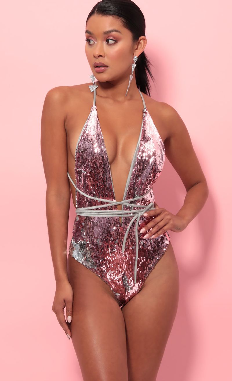 Picture Pacific Plunge Sequin Swimsuit in Mauve Silver. Source: https://media.lucyinthesky.com/data/May19_2/800xAUTO/781A1175.JPG