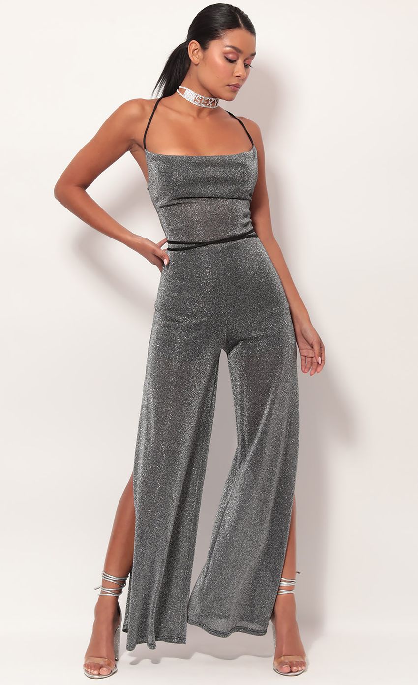 Picture Eliana Cowl Neck Jumpsuit in Black Shimmer. Source: https://media.lucyinthesky.com/data/May19_2/850xAUTO/781A0715.JPG
