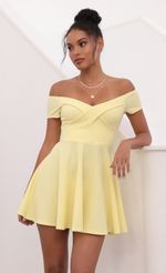 Picture Ambrose Pleated A-line Dress in Yellow. Source: https://media.lucyinthesky.com/data/May21_1/150xAUTO/1V9A1297S.JPG