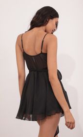 Picture thumb Ava Wrap Dress in Black Shimmer. Source: https://media.lucyinthesky.com/data/May21_1/170xAUTO/1V9A5536.JPG