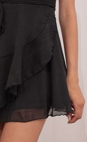 Picture thumb Ava Wrap Dress in Black Shimmer. Source: https://media.lucyinthesky.com/data/May21_1/170xAUTO/1V9A5550.JPG