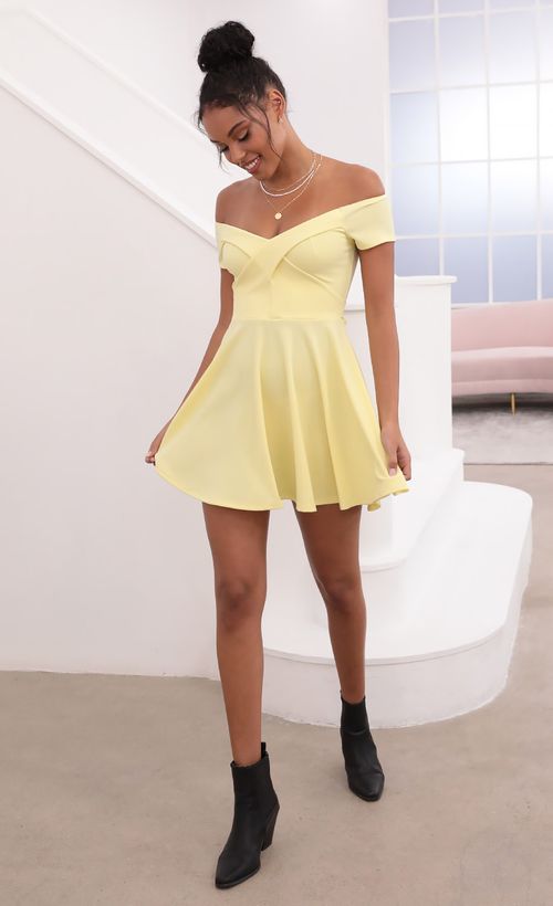 Picture Ambrose Pleated A-line Dress in Yellow. Source: https://media.lucyinthesky.com/data/May21_1/500xAUTO/1V9A1183.JPG