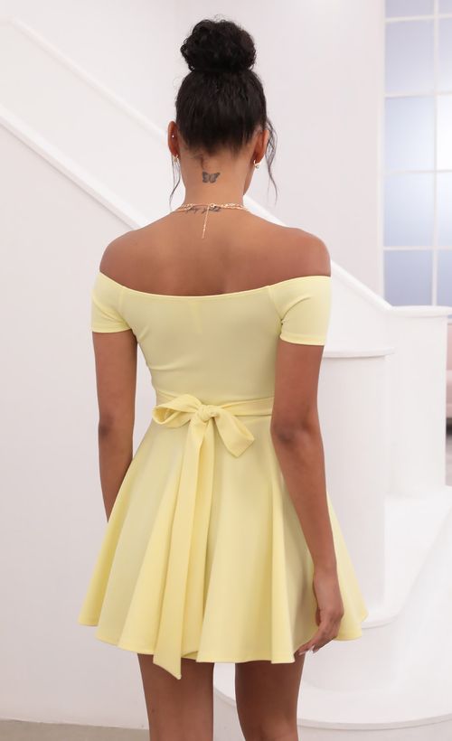 Picture Ambrose Pleated A-line Dress in Yellow. Source: https://media.lucyinthesky.com/data/May21_1/500xAUTO/1V9A1259.JPG