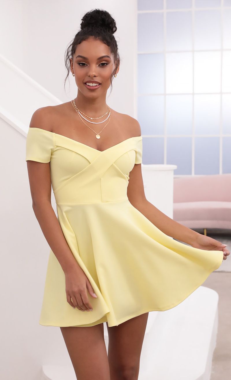 Picture Ambrose Pleated A-line Dress in Yellow. Source: https://media.lucyinthesky.com/data/May21_1/800xAUTO/1V9A1254.JPG