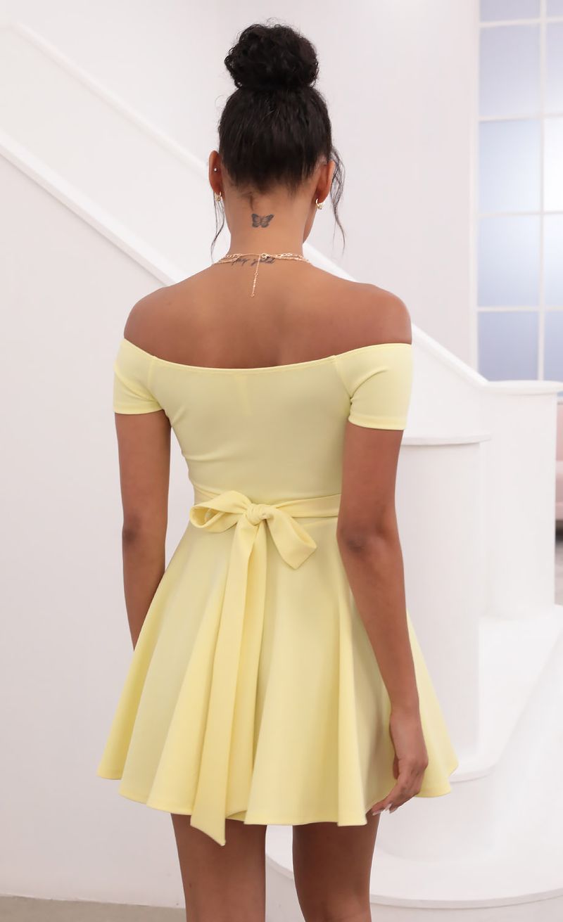 Picture Ambrose Pleated A-line Dress in Yellow. Source: https://media.lucyinthesky.com/data/May21_1/800xAUTO/1V9A1259.JPG