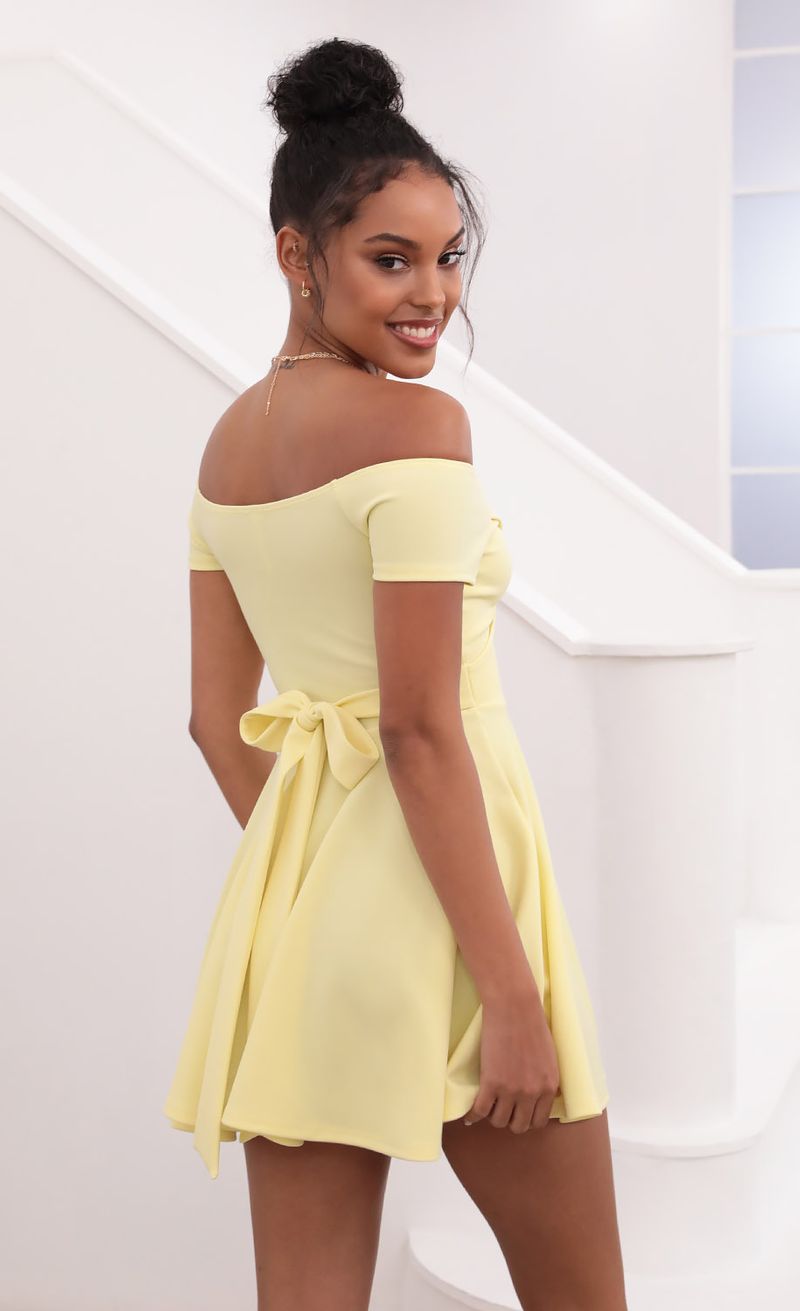 Picture Ambrose Pleated A-line Dress in Yellow. Source: https://media.lucyinthesky.com/data/May21_1/800xAUTO/1V9A1266.JPG