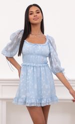 Picture April Puff Sleeve Dress in Light Blue Floral Chiffon. Source: https://media.lucyinthesky.com/data/May21_2/150xAUTO/1V9A4979.JPG