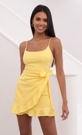 Picture thumb Capri Ruffle Tie Dress in Light Yellow. Source: https://media.lucyinthesky.com/data/May21_2/170xAUTO/1V9A1839.JPG
