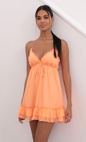 Picture thumb Brenda Tangerine Dress in Dotted Chiffon. Source: https://media.lucyinthesky.com/data/May21_2/170xAUTO/1V9A3848.JPG
