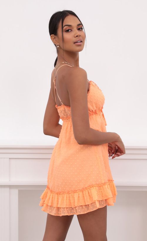 Picture Brenda Tangerine Dress in Dotted Chiffon. Source: https://media.lucyinthesky.com/data/May21_2/500xAUTO/1V9A3738.JPG