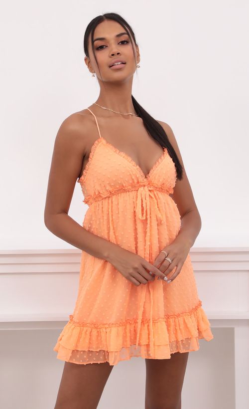 Picture Brenda Tangerine Dress in Dotted Chiffon. Source: https://media.lucyinthesky.com/data/May21_2/500xAUTO/1V9A3771.JPG