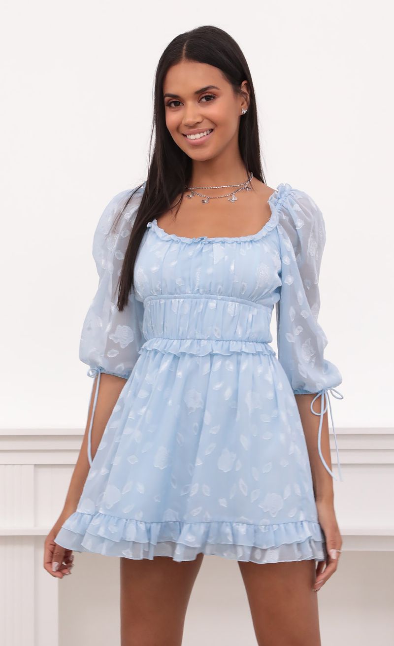 Picture April Puff Sleeve Dress in Light Blue Floral Chiffon. Source: https://media.lucyinthesky.com/data/May21_2/800xAUTO/1V9A4990.JPG
