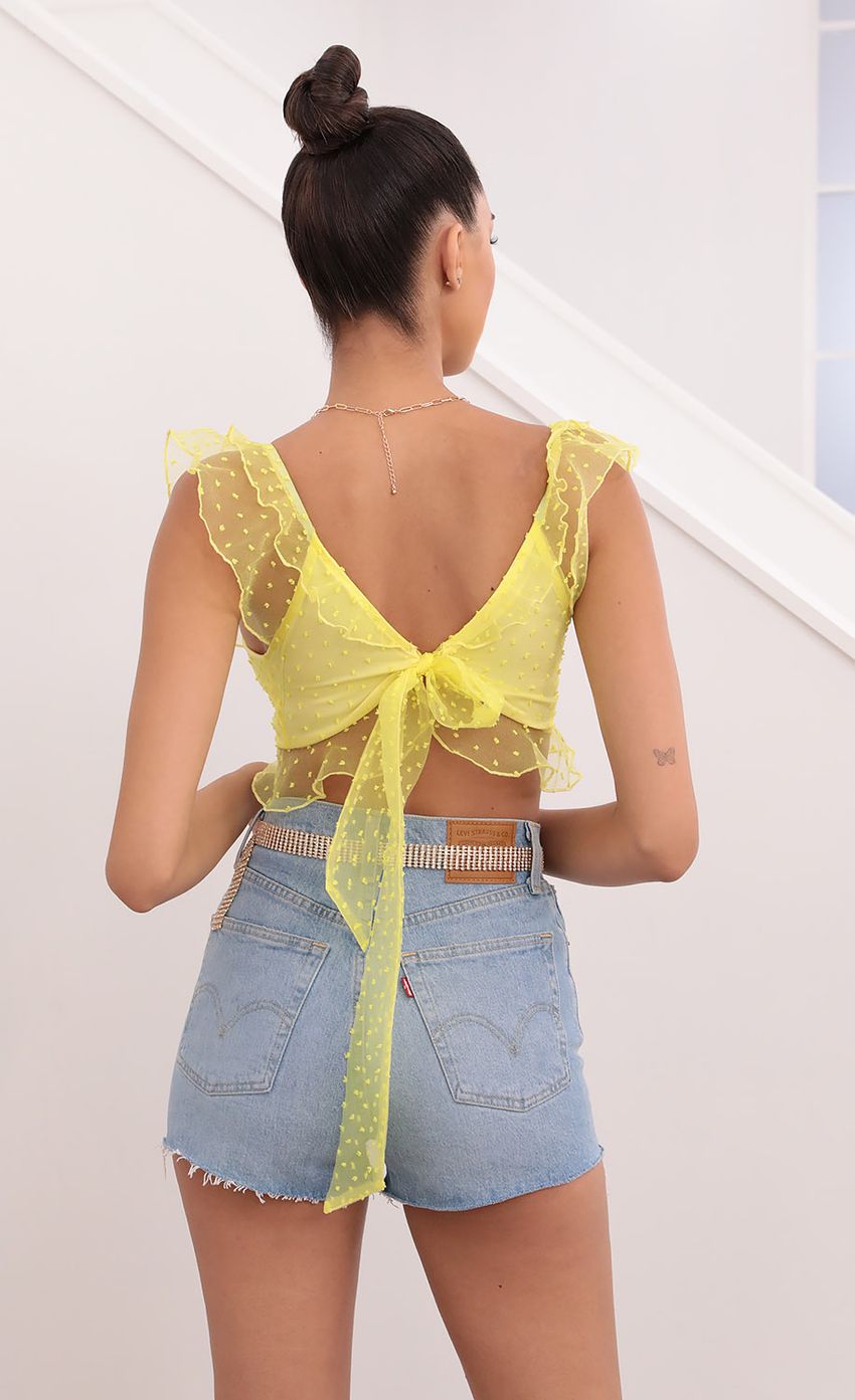 Picture Caris Dotted Chiffon Top in Yellow. Source: https://media.lucyinthesky.com/data/May21_2/850xAUTO/1V9A0959.JPG