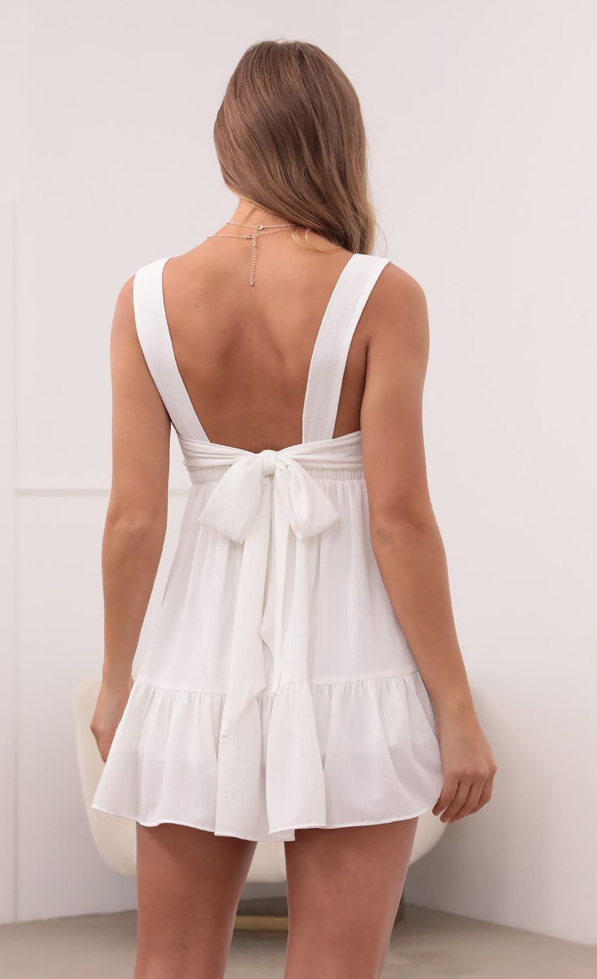 Picture Aurora Square Neckline Dress in White Pinstripes. Source: https://media.lucyinthesky.com/data/May21_2/850xAUTO/1V9A3013.JPG