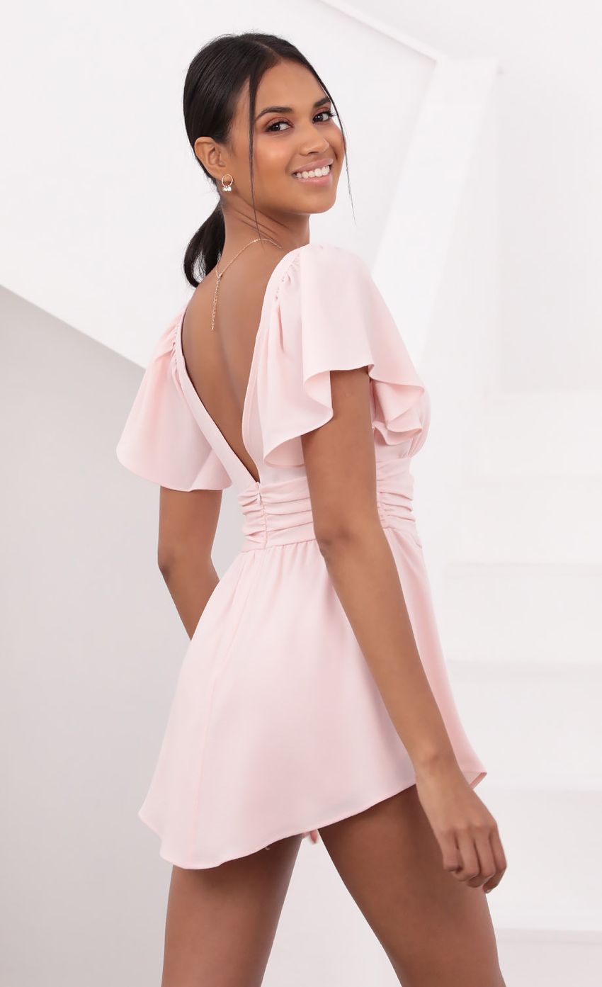 Picture Alexia Flutter Sleeved Dress in Baby Pink. Source: https://media.lucyinthesky.com/data/May21_2/850xAUTO/1V9A35991.JPG