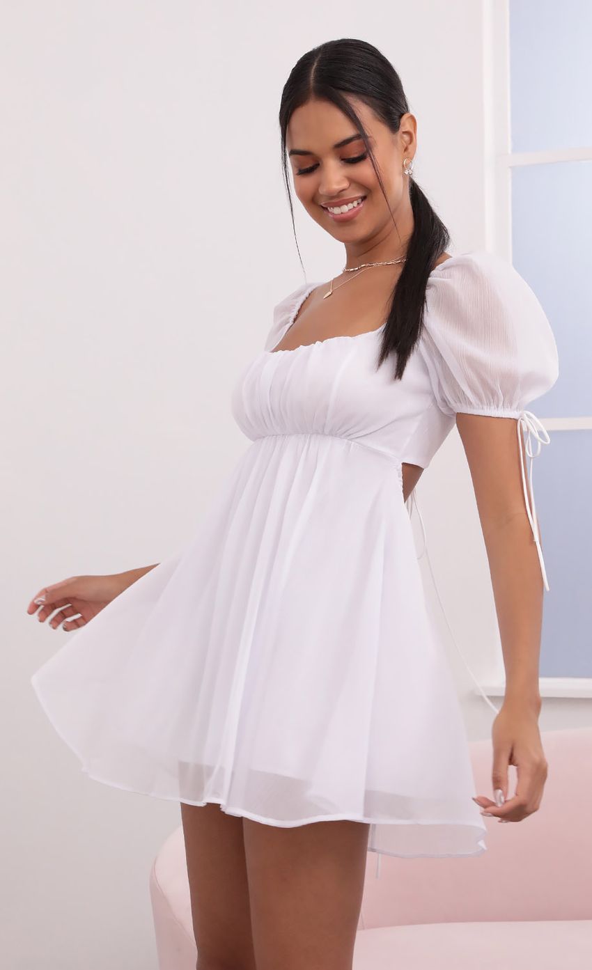 Picture Leilani Crinkle Chiffon Baby Doll Dress in White. Source: https://media.lucyinthesky.com/data/May21_2/850xAUTO/1V9A3908.JPG