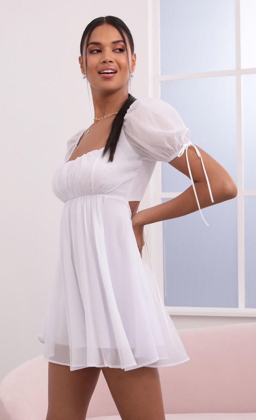 Picture Leilani Crinkle Chiffon Baby Doll Dress in White. Source: https://media.lucyinthesky.com/data/May21_2/850xAUTO/1V9A3927.JPG