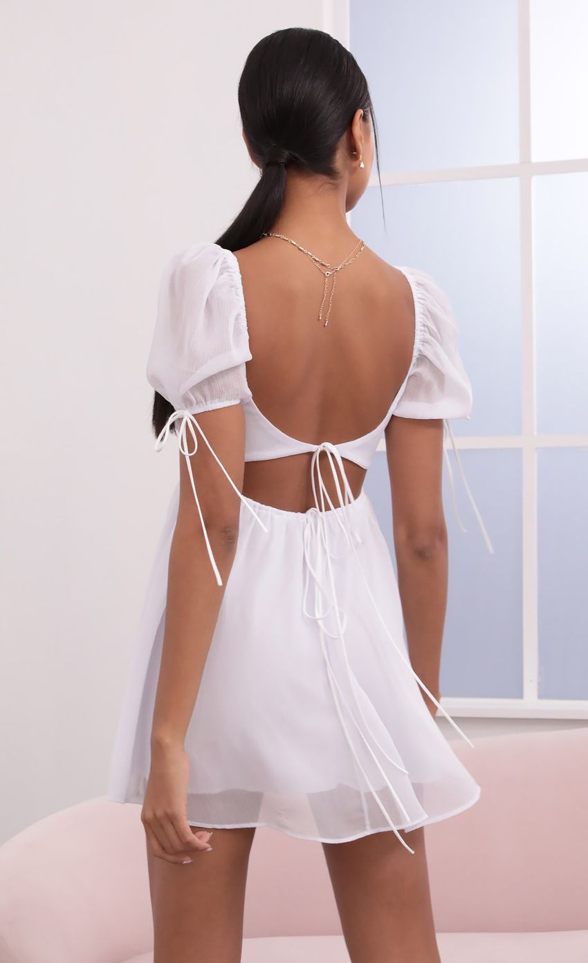Picture Leilani Crinkle Chiffon Baby Doll Dress in White. Source: https://media.lucyinthesky.com/data/May21_2/850xAUTO/1V9A3970.JPG