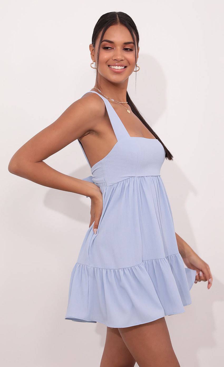 Picture Aurora Square Neckline Dress in Blue Pinstripes. Source: https://media.lucyinthesky.com/data/May21_2/850xAUTO/1V9A4224.JPG