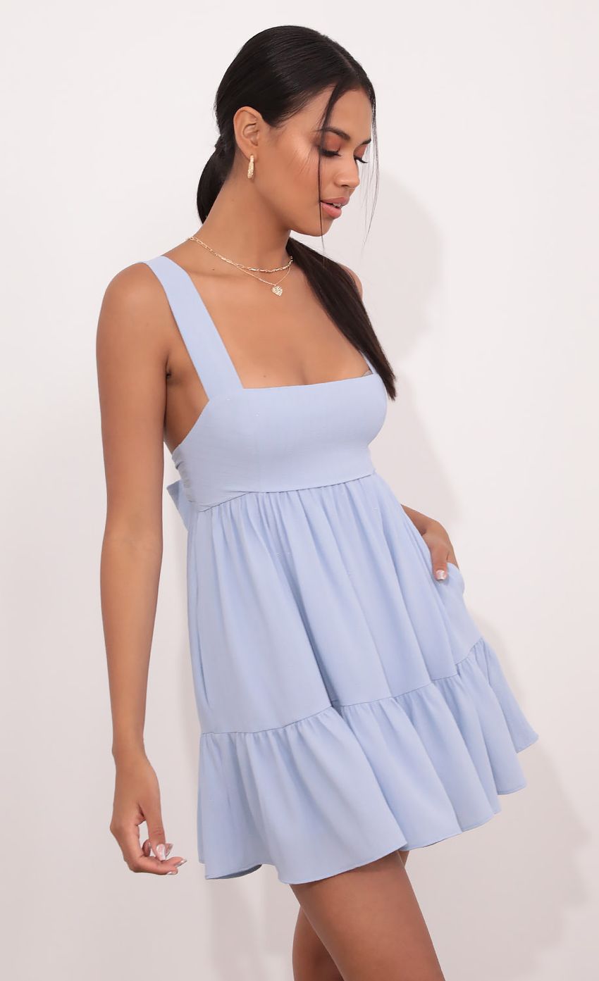 Picture Aurora Square Neckline Dress in Blue Pinstripes. Source: https://media.lucyinthesky.com/data/May21_2/850xAUTO/1V9A4296.JPG