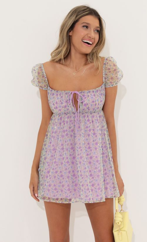 Picture Odessa Sequin Baby Doll Dress in Purple Floral. Source: https://media.lucyinthesky.com/data/May22_1/500xAUTO/1V9A61621.JPG