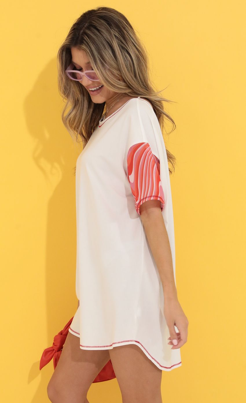 Picture Lessie Shirt Dress in White and Red Swirl. Source: https://media.lucyinthesky.com/data/May22_1/850xAUTO/1V9A9263.JPG