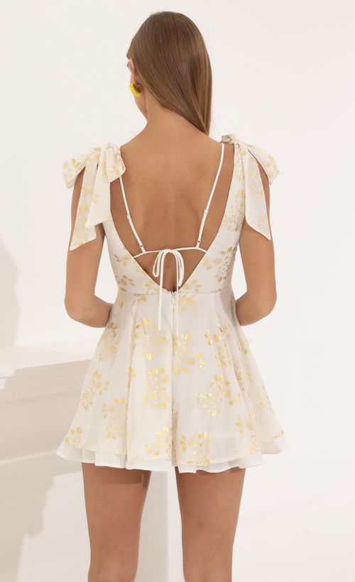Picture Lilo Chiffon Fit and Flare Dress in Gold Foil. Source: https://media.lucyinthesky.com/data/May22_2/500xAUTO/1V9A6708.JPG