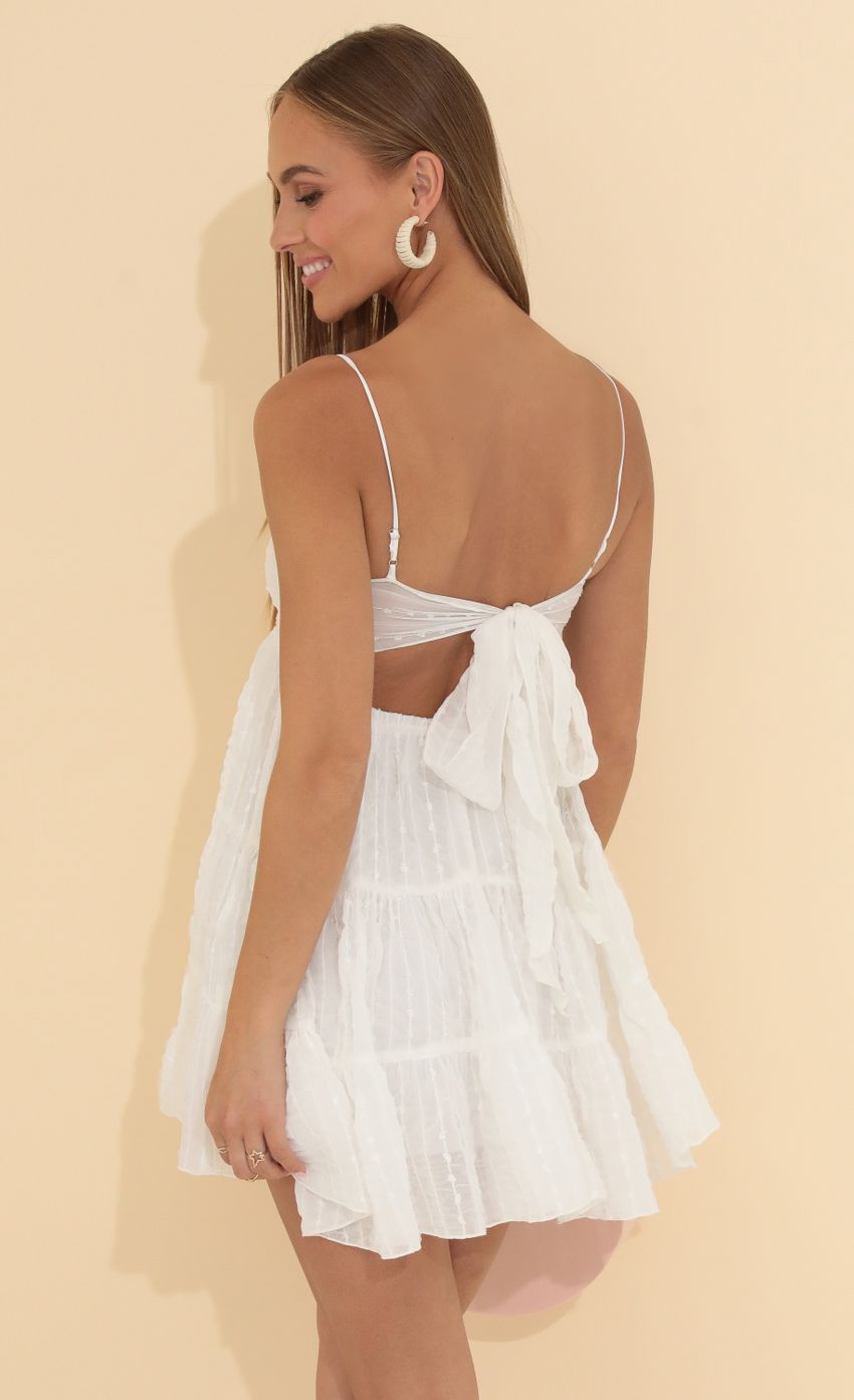 Picture Cindy Striped Chelsea Chiffon Dress in White. Source: https://media.lucyinthesky.com/data/May22_2/850xAUTO/1V9A9133.JPG