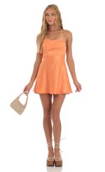 Picture Rowena Swirl A-Line Mini Dress in Orange. Source: https://media.lucyinthesky.com/data/May23/150xAUTO/4f7e27bb-0456-4f61-9843-66509697be26.jpg