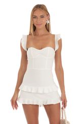 Picture Brandi Ruffle Corset Dress in White. Source: https://media.lucyinthesky.com/data/May23/150xAUTO/f0076bf1-3933-4eb6-bede-3f8b33a8f850.jpg