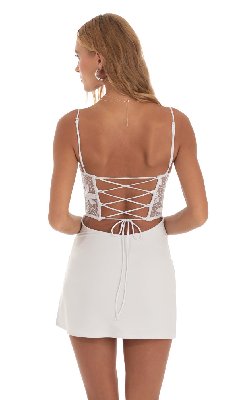 Picture Loxley Embroidered Sequin Cutout Mini Dress in White. Source: https://media.lucyinthesky.com/data/May23/850xAUTO/0ac75202-5000-4951-ba9c-fec6bc1d0fdf.jpg