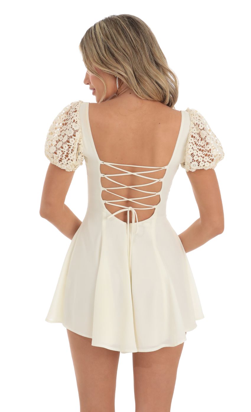 Picture Wannda Puff Sleeve Dress in Cream with Crochet Sleeves. Source: https://media.lucyinthesky.com/data/May23/850xAUTO/472db4f5-fc53-4fb7-b7d9-fac6162caed5.jpg
